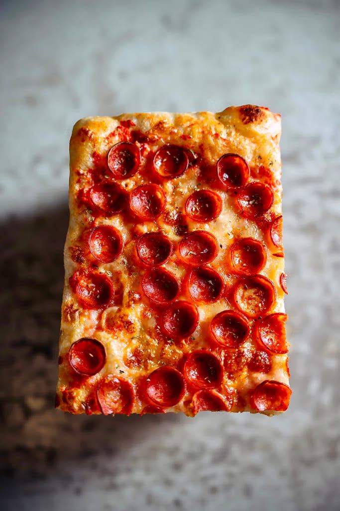NY Pepperoni sourdough pizza slice covered in cup n' char pepperoni