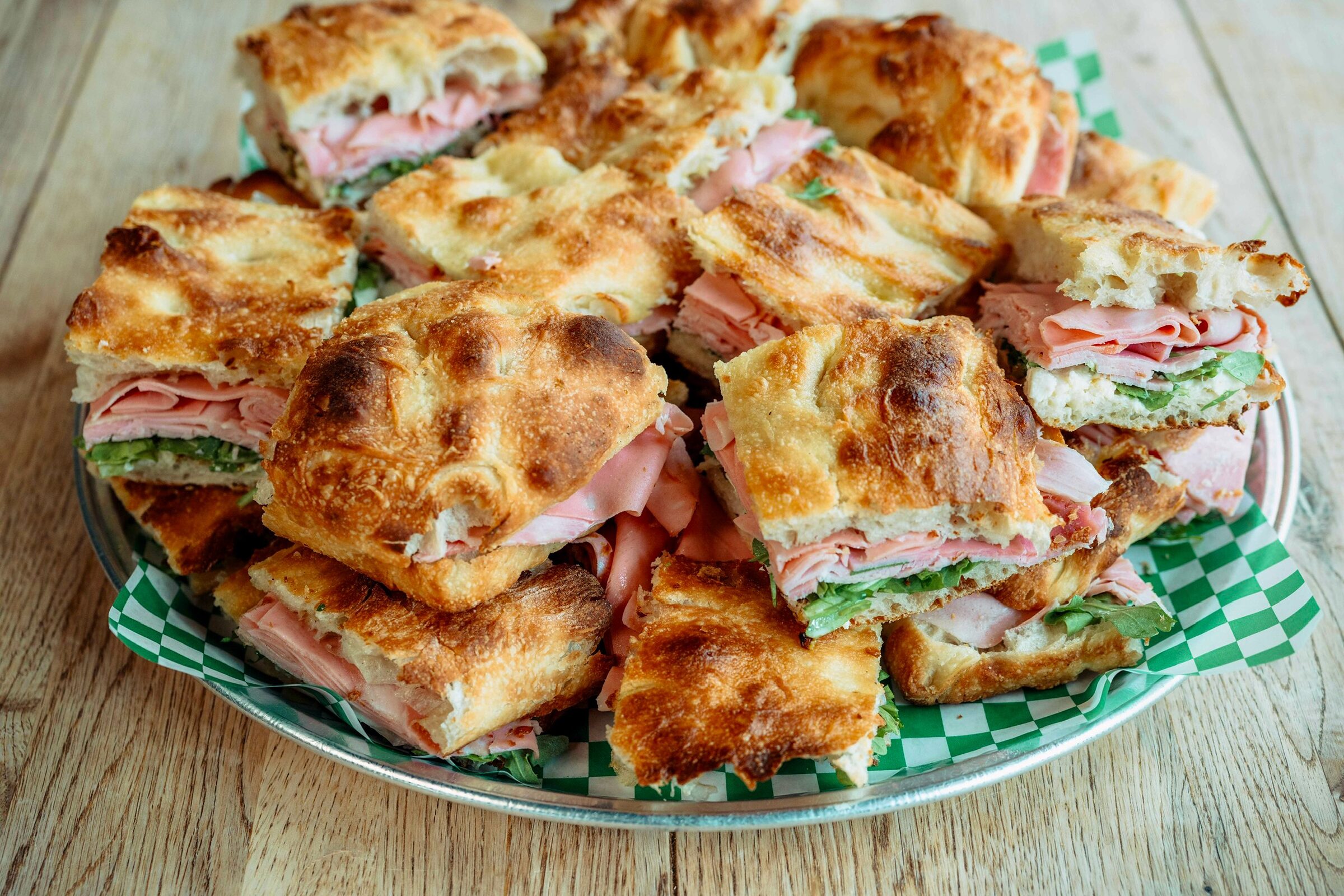 Focaccia sandwiches in Scarborough, cut and stacked on a platter at Penelope Bakehouse