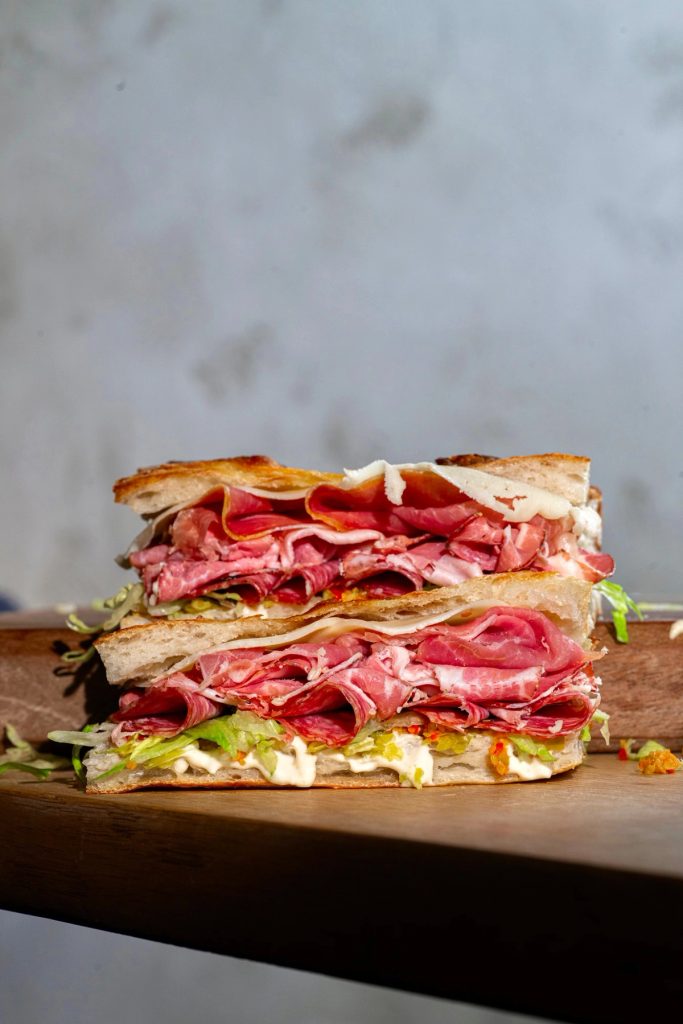 Italian focaccia sandwich with salami, capocollo, prosciutto and provolone